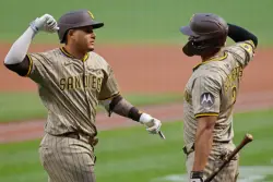 Tatis, back in lineup despite bruised arm, sparks Padres to 2-1 victory
